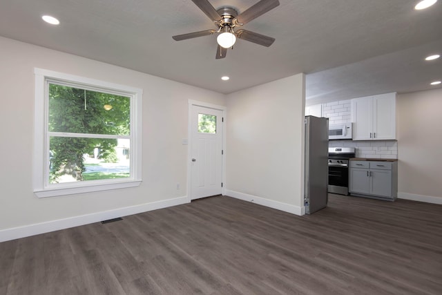 1830 N Hillcrest Ave, Springfield, MO 65802 - unfurnished living room featuring dark wood finished floors, recessed lighting, and ceiling fan