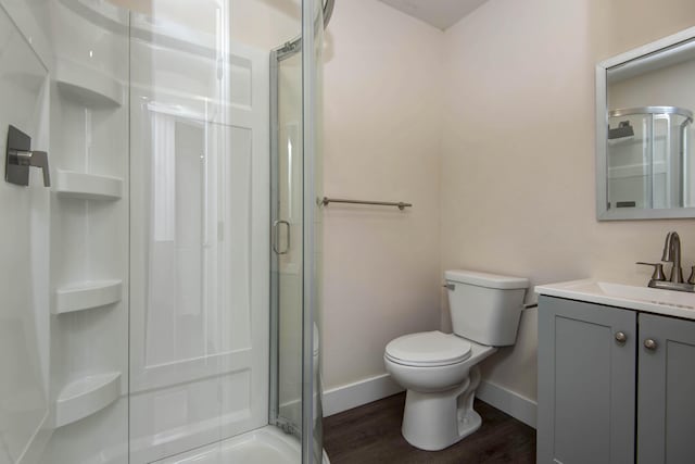 1830 N Hillcrest Ave, Springfield, MO 65802 - full bathroom with a stall shower, vanity, and wood finished floors
