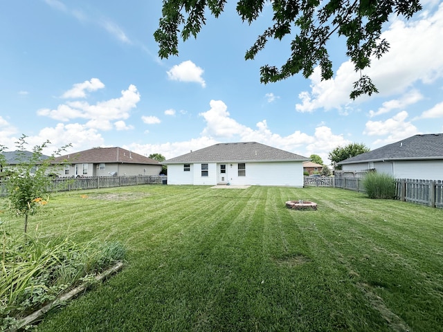 751 Logan St, Rogersville, MO 65742 - rear view of property featuring a fire pit and a fenced backyard