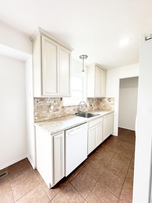 751 Logan St, Rogersville, MO 65742 - kitchen with dishwasher, backsplash, light countertops, light tile patterned flooring, and decorative light fixtures