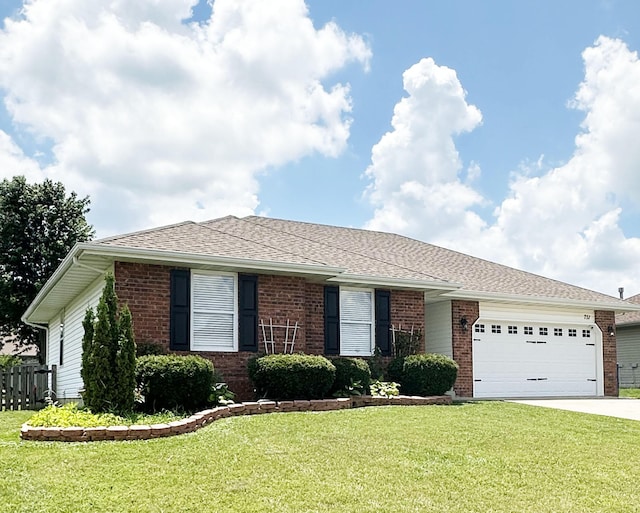 751 Logan St, Rogersville, MO 65742 - single story home with an attached garage, driveway, a front lawn, and brick siding