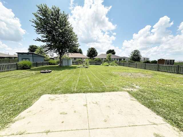 751 Logan St, Rogersville, MO 65742 - fenced backyard with a storage unit, a patio, and an outdoor fire pit