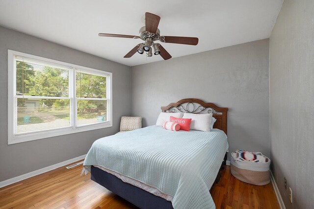 1704 E Latoka St, Springfield, MO 65804 - bedroom featuring wood finished floors and a ceiling fan