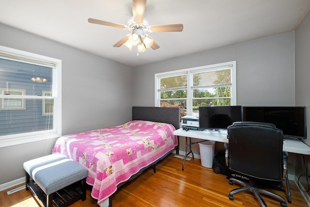 1704 E Latoka St, Springfield, MO 65804 - bedroom featuring wood finished floors, an office area, and a ceiling fan