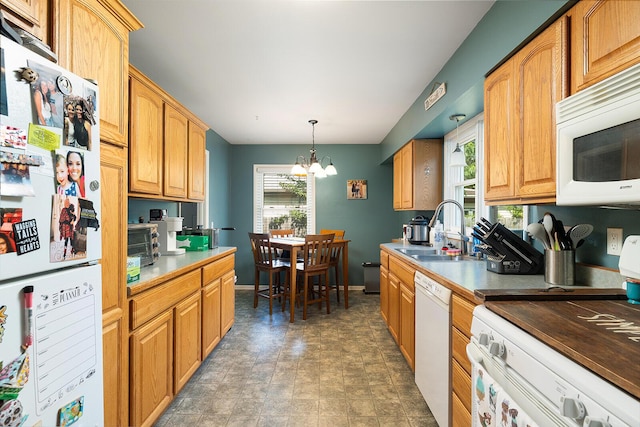 1704 E Latoka St, Springfield, MO 65804 - kitchen with white appliances, a chandelier, and decorative light fixtures
