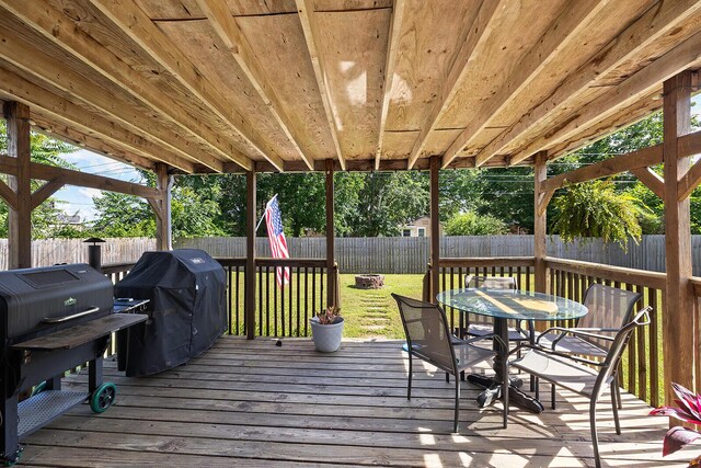 1704 E Latoka St, Springfield, MO 65804 - deck with outdoor dining area, area for grilling, and a fenced backyard