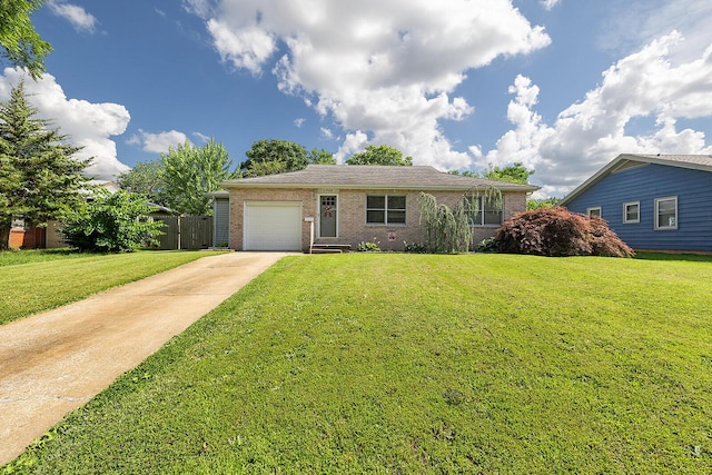 1704 E Latoka St, Springfield, MO 65804 - view of front of house with driveway, an attached garage, and brick siding
