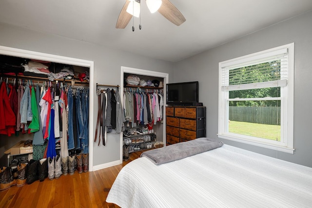 1704 E Latoka St, Springfield, MO 65804 - bedroom featuring wood finished floors, two closets, and a ceiling fan