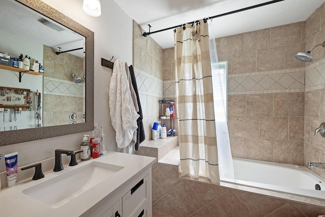 1704 E Latoka St, Springfield, MO 65804 - full bathroom featuring vanity and tiled shower / bath combo