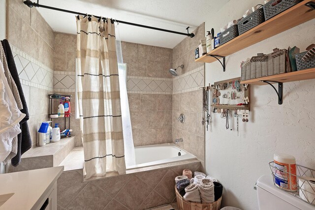 1704 E Latoka St, Springfield, MO 65804 - full bathroom featuring tiled shower / bath combo, vanity, and tile patterned flooring