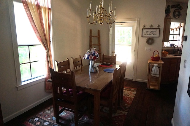 1350 Pointe Royale Dr, Branson, MO 65616 - dining space with a chandelier, dark wood-style floors, and healthy amount of natural light