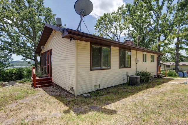 730 Peebles Point Rd, Cape Fair, MO 65624 - view of side of property with a central AC unit and a chimney