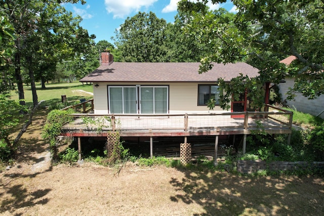 730 Peebles Point Rd, Cape Fair, MO 65624 - view of front facade featuring a deck, a chimney, a shingled roof, and a front lawn