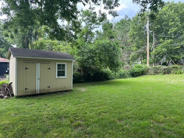 514 N Joplin Ave, Joplin, MO 64801 - view of green lawn with a shed