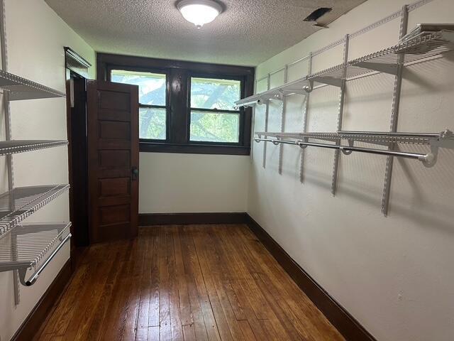 514 N Joplin Ave, Joplin, MO 64801 - walk in closet with hardwood / wood-style floors