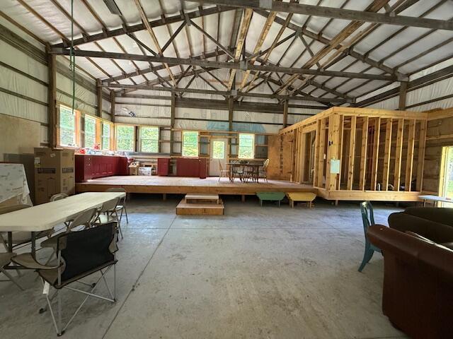 890 Bluebird Ln, Sparta, MO 65753 - miscellaneous room with unfinished concrete flooring and high vaulted ceiling