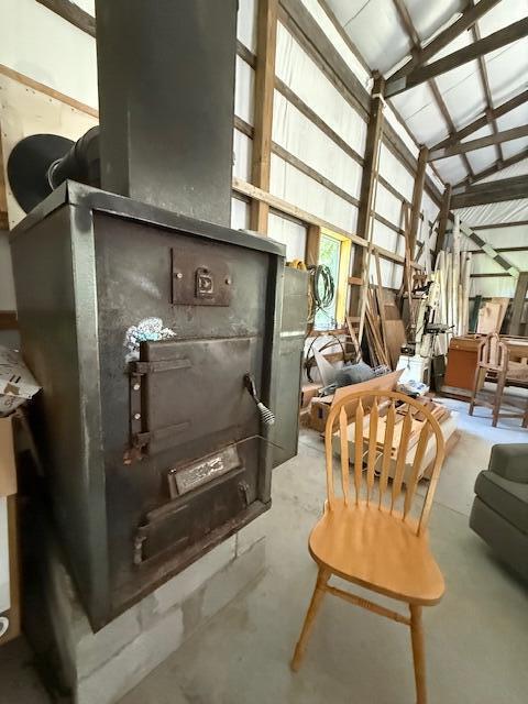890 Bluebird Ln, Sparta, MO 65753 - interior space featuring concrete floors and vaulted ceiling