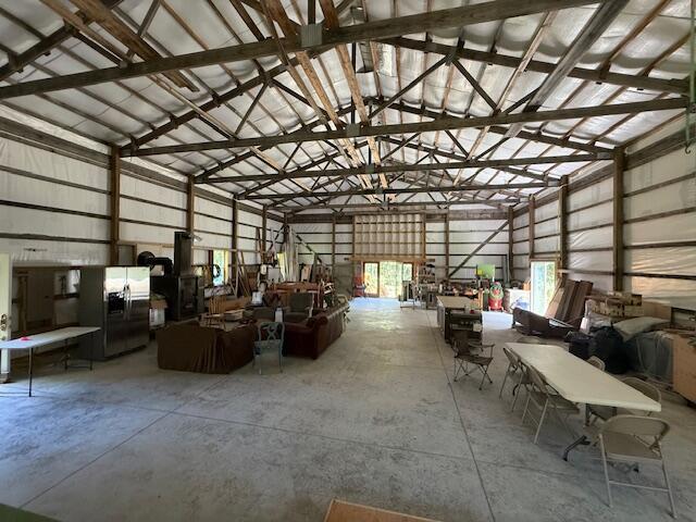 890 Bluebird Ln, Sparta, MO 65753 - garage with stainless steel fridge