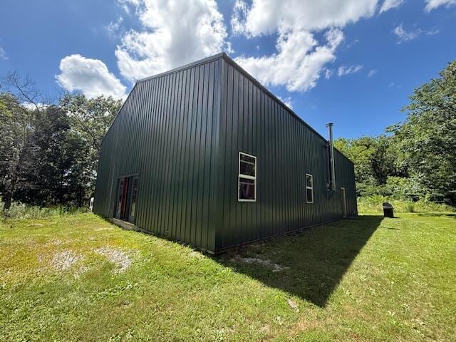 890 Bluebird Ln, Sparta, MO 65753 - view of side of property featuring a yard, an outdoor structure, a pole building, and board and batten siding