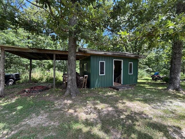 890 Bluebird Ln, Sparta, MO 65753 - view of outdoor structure featuring a carport