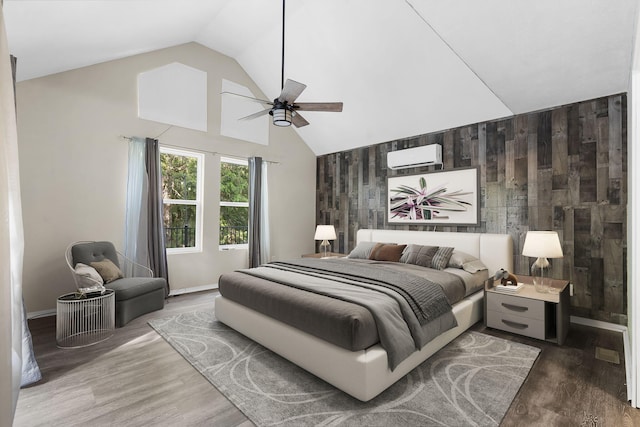 167 Eagle Valley Ct, Hollister, MO 65672 - bedroom with an AC wall unit, high vaulted ceiling, wooden walls, ceiling fan, and wood finished floors