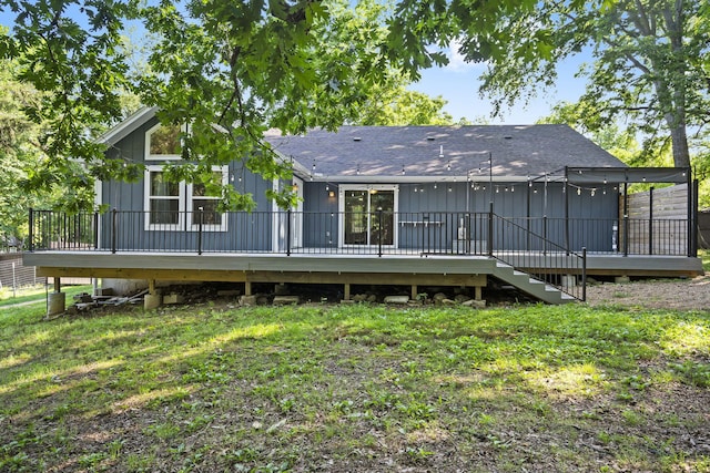 167 Eagle Valley Ct, Hollister, MO 65672 - rear view of house featuring a shingled roof, a wooden deck, and a yard