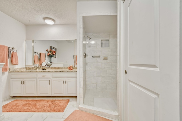 29 Trail Ridge Dr, Kimberling City, MO 65686 - bathroom featuring vanity, walk in shower, tile patterned flooring, and a textured ceiling