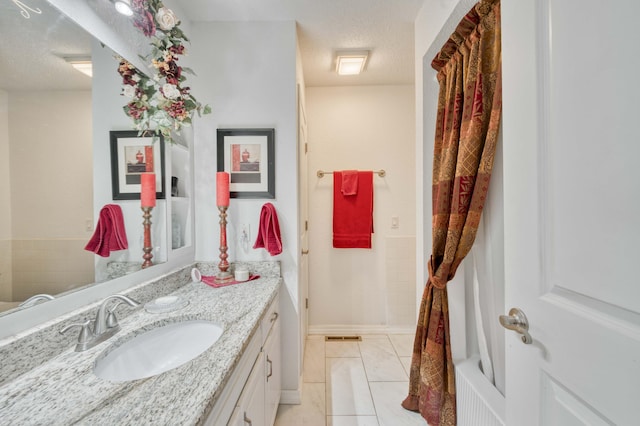 29 Trail Ridge Dr, Kimberling City, MO 65686 - full bath with vanity, a textured ceiling, and tile patterned flooring