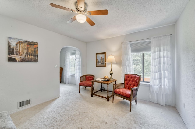 29 Trail Ridge Dr, Kimberling City, MO 65686 - sitting room with arched walkways, carpet floors, a ceiling fan, and a textured ceiling