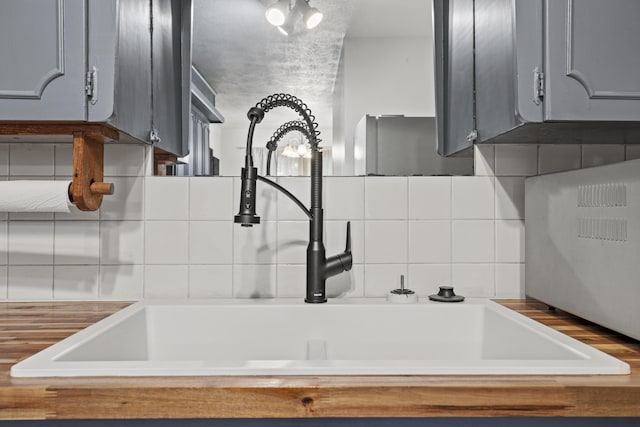 716 S Rogers Ave, Springfield, MO 65804 - kitchen view of backsplash and gray cabinetry