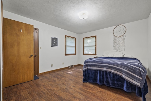 716 S Rogers Ave, Springfield, MO 65804 - bedroom with wood finished floors and a textured ceiling