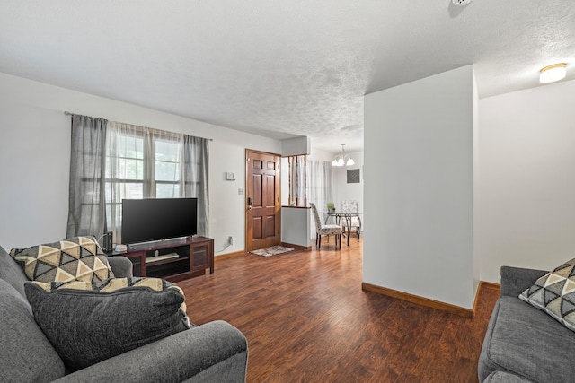 716 S Rogers Ave, Springfield, MO 65804 - living area with wood finished floors, a textured ceiling, and a chandelier