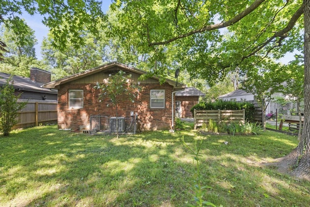 716 S Rogers Ave, Springfield, MO 65804 - back of house featuring brick siding