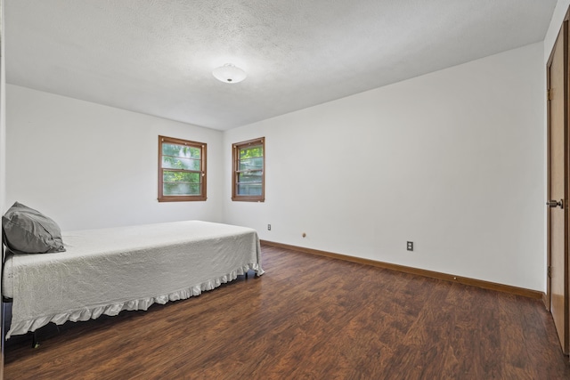 716 S Rogers Ave, Springfield, MO 65804 - bedroom with wood finished floors and a textured ceiling