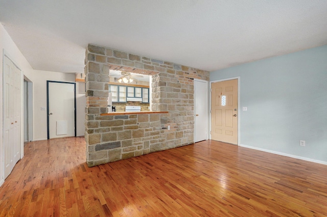 1111 S Lone Pine Ave, Springfield, MO 65804 - unfurnished living room with wood finished floors