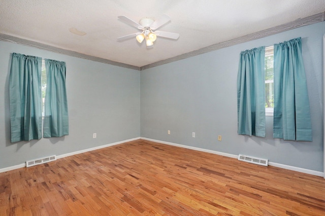 1111 S Lone Pine Ave, Springfield, MO 65804 - empty room with light wood-style floors, ceiling fan, and ornamental molding