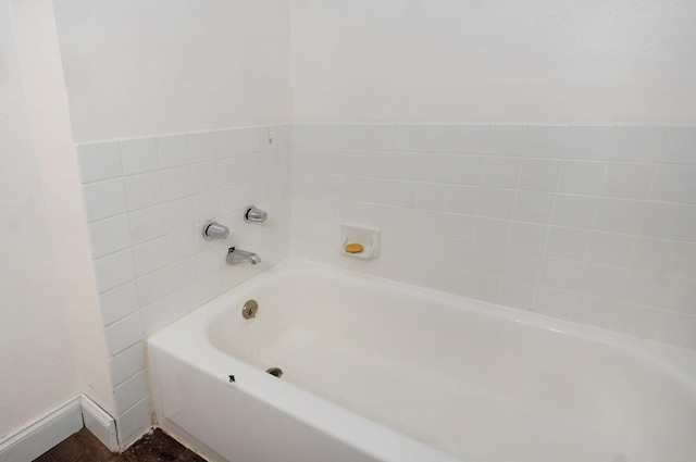1111 S Lone Pine Ave, Springfield, MO 65804 - full bathroom featuring a garden tub and baseboards