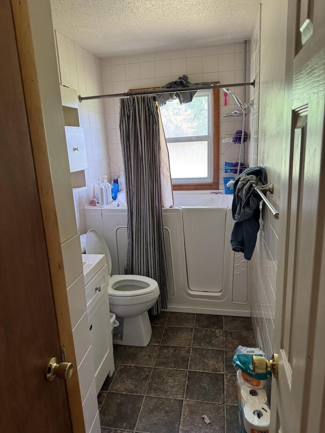 806 Lathrop Ave, Ava, MO 65608 - full bathroom with tile walls, a textured ceiling, separate washer and dryer, a shower with shower curtain, and a tub to relax in