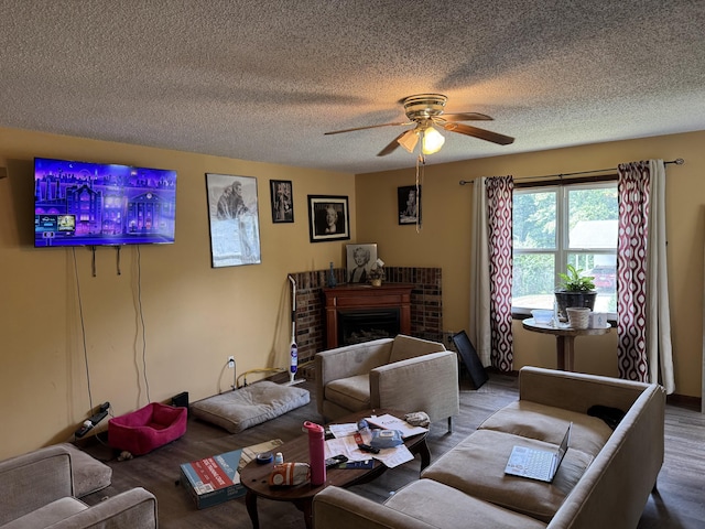 806 Lathrop Ave, Ava, MO 65608 - living room with a ceiling fan, wood finished floors, a textured ceiling, and a fireplace
