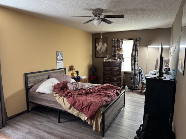 806 Lathrop Ave, Ava, MO 65608 - bedroom featuring wood finished floors, a textured ceiling, and ceiling fan