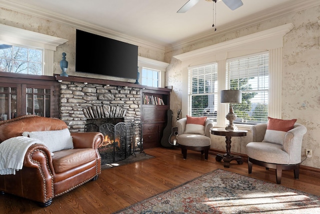 120 N 4th St, Branson, MO 65616 - sitting room featuring wallpapered walls, wood finished floors, a ceiling fan, a fireplace, and crown molding