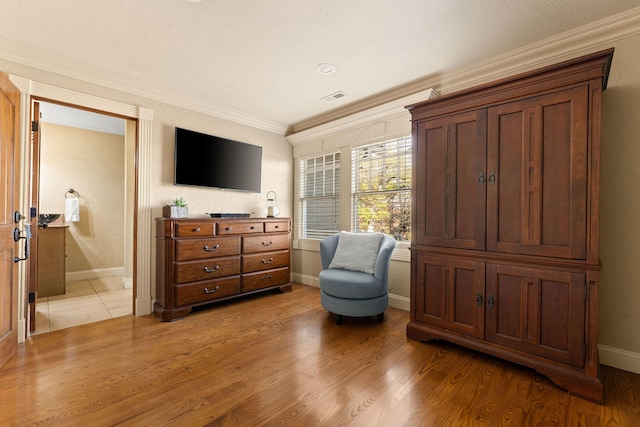 120 N 4th St, Branson, MO 65616 - sitting room featuring crown molding and light wood finished floors