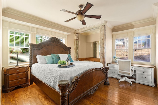 120 N 4th St, Branson, MO 65616 - bedroom with wood finished floors, ornamental molding, a desk, and ceiling fan