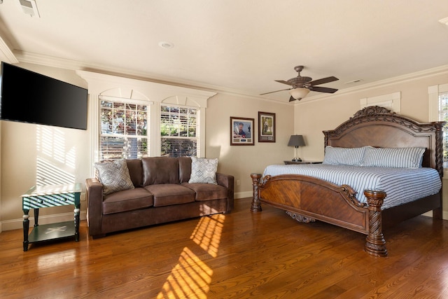 120 N 4th St, Branson, MO 65616 - bedroom with multiple windows, wood finished floors, ornamental molding, and a ceiling fan