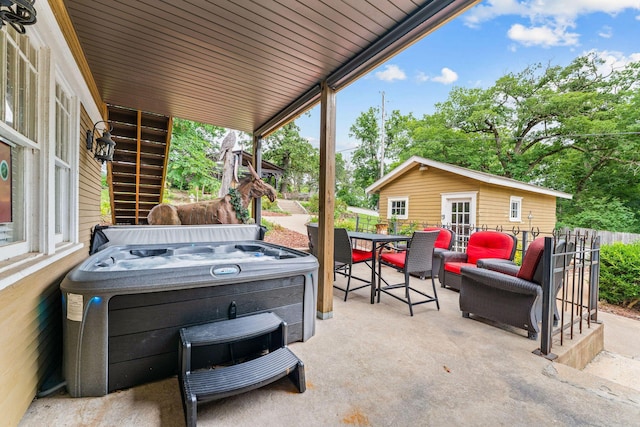 120 N 4th St, Branson, MO 65616 - view of patio / terrace featuring a hot tub, stairway, outdoor dining area, and an outdoor structure