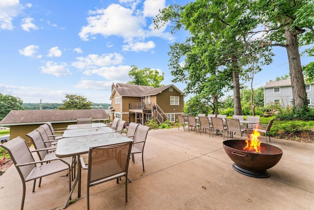 120 N 4th St, Branson, MO 65616 - view of patio / terrace featuring an outdoor fire pit and outdoor dining area