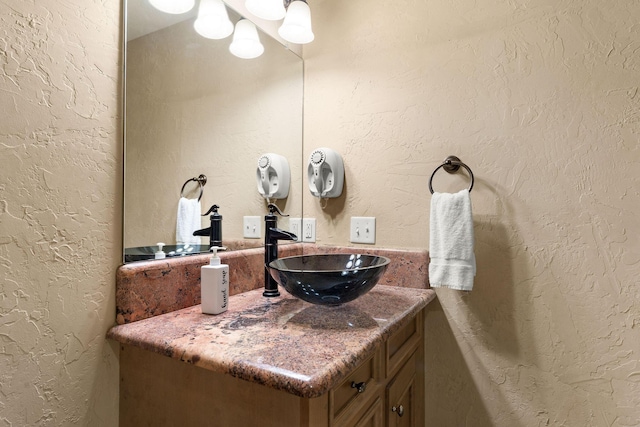 120 N 4th St, Branson, MO 65616 - bathroom featuring vanity and a textured wall