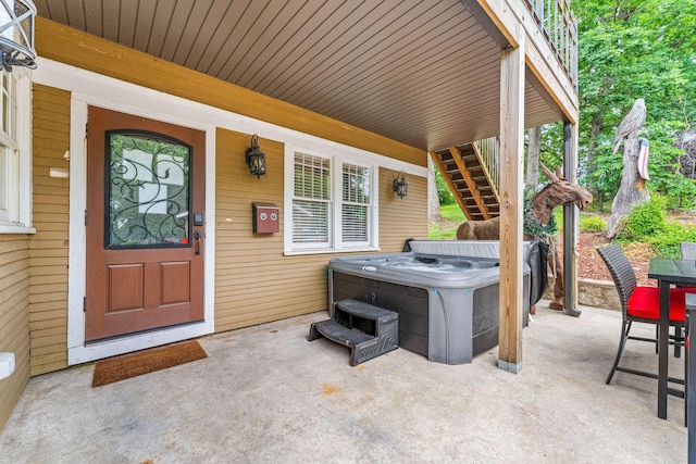 120 N 4th St, Branson, MO 65616 - view of patio featuring a hot tub and stairs