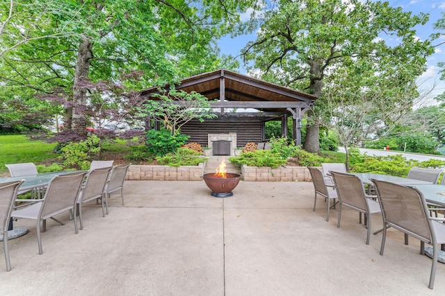120 N 4th St, Branson, MO 65616 - view of patio / terrace with outdoor dining space, a gazebo, and an outdoor fire pit