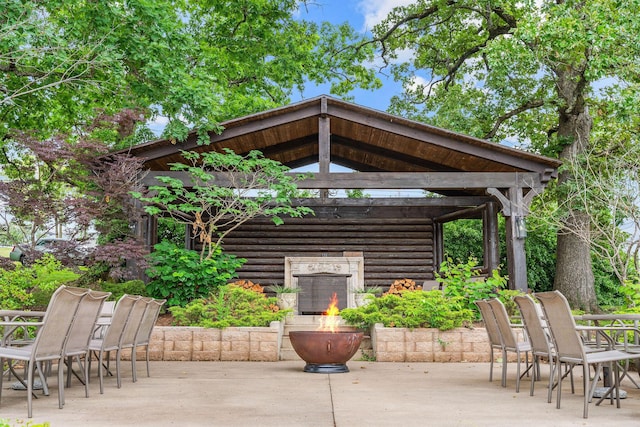 120 N 4th St, Branson, MO 65616 - view of patio / terrace with a fire pit, a gazebo, and outdoor dining space